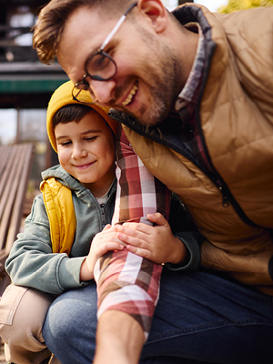 Dad and son looking at something