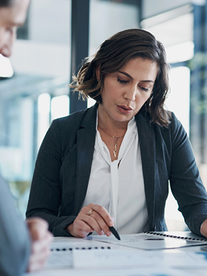 woman writing on a paper