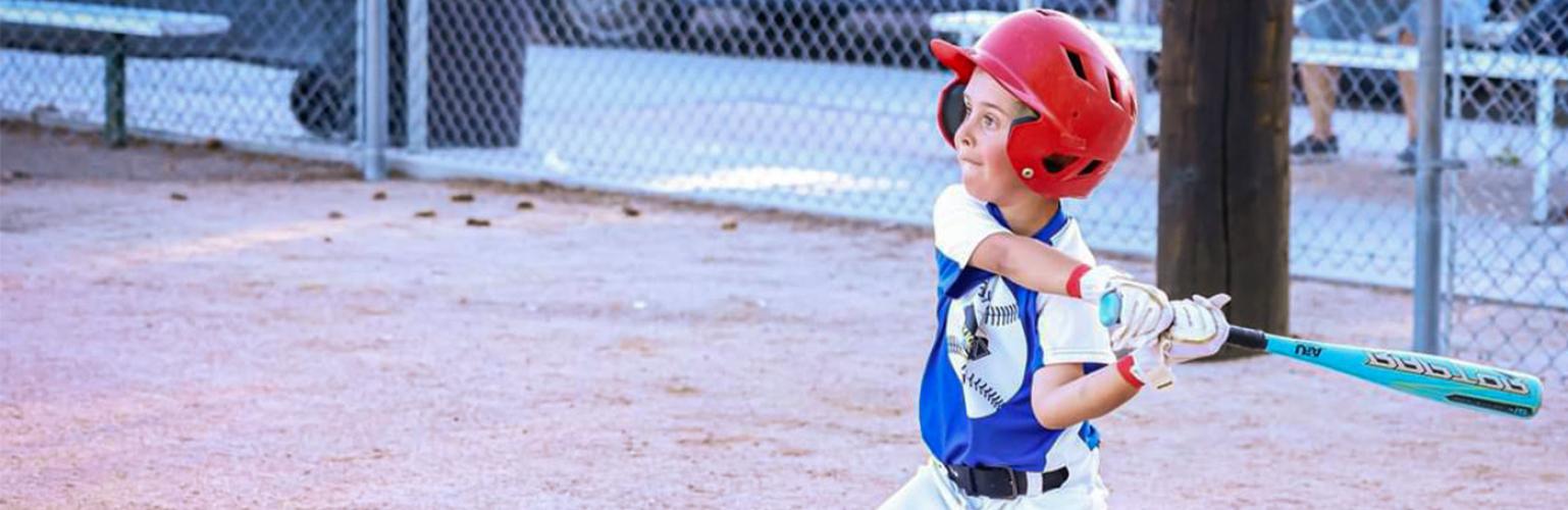 young baseball player getting ready to bat