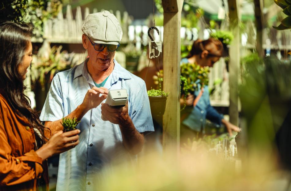 man and woman using a Clover payment option