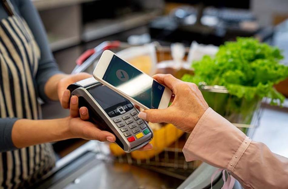 picture of someone paying with their phone