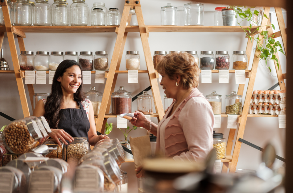 2 WOMEN WORKING AT A SMALL SHOP